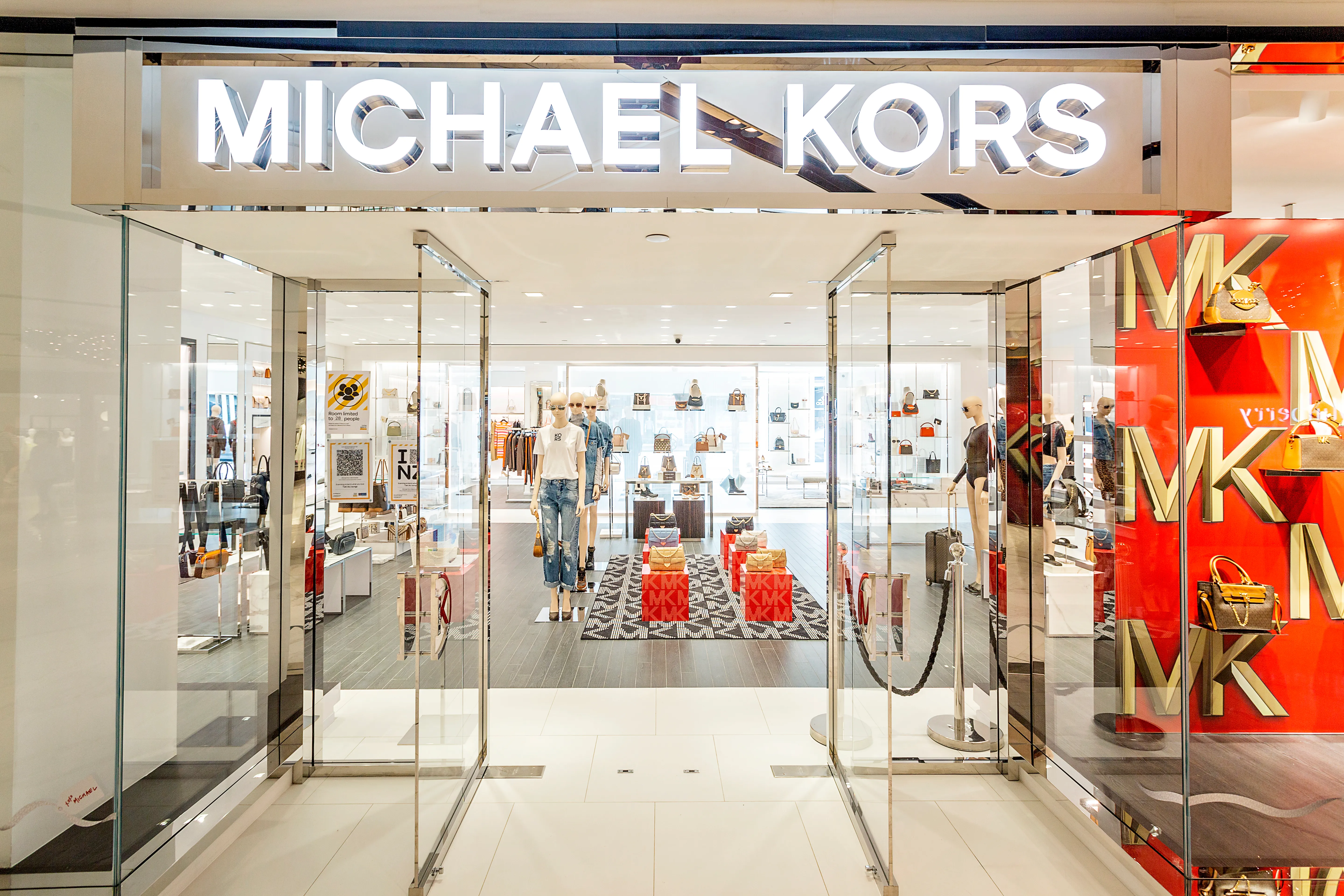 Michael Kors storefront with illuminated signage, Auckland
