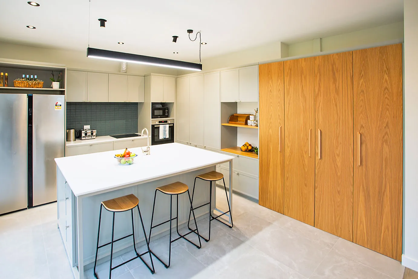 Kings Road villa kitchen with white island and timber joinery, Auckland
