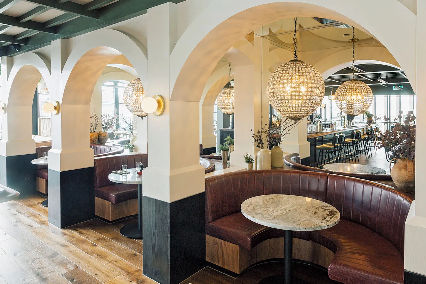 Saxon + Parole two-storey restaurant interior with feature planting, Quay Street, Auckland