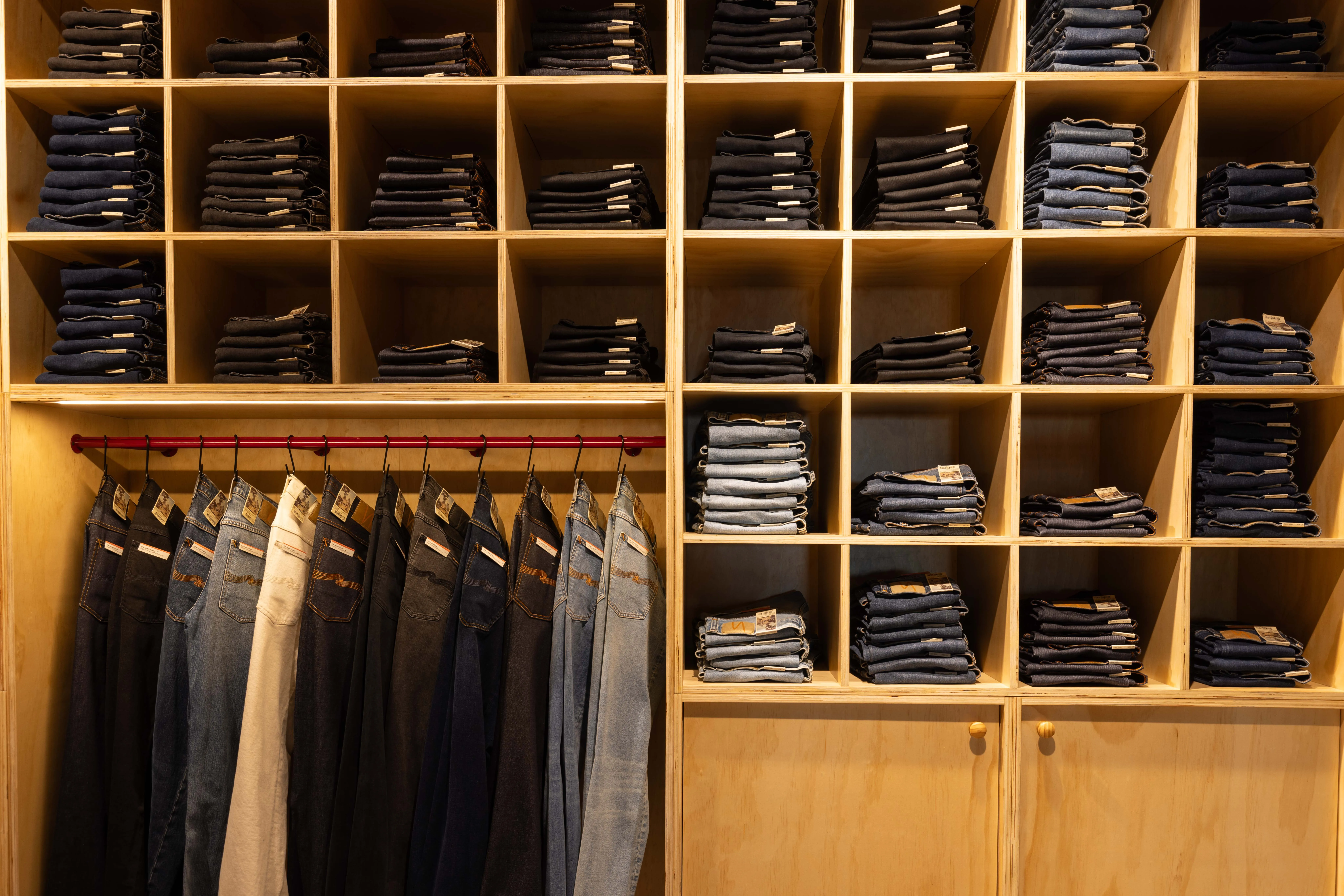 Nudie Jeans store with timber shelving and glass frontage, Commercial Bay, Auckland