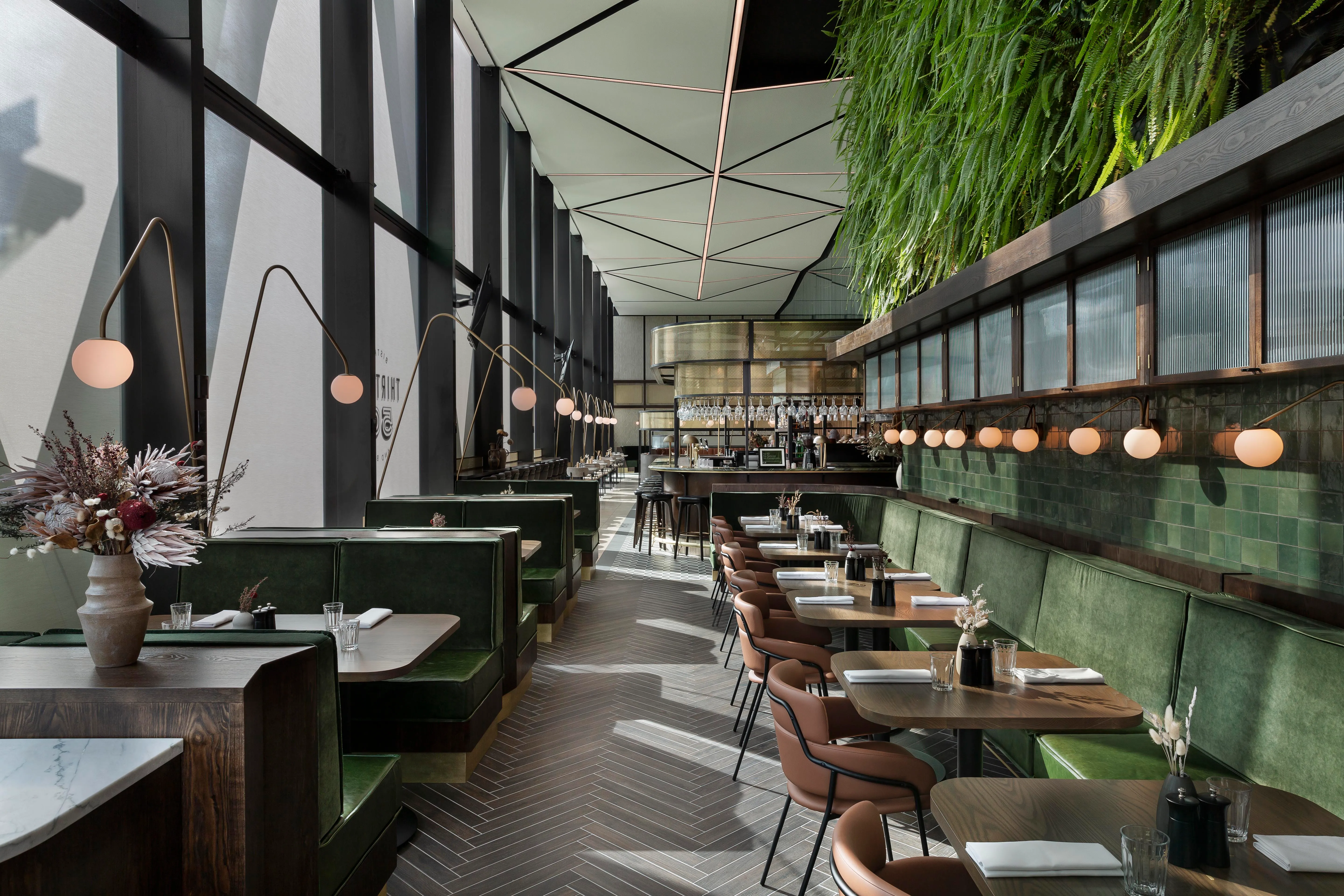 Refurbished Novotel restaurant and bar with green banquettes, Auckland Airport