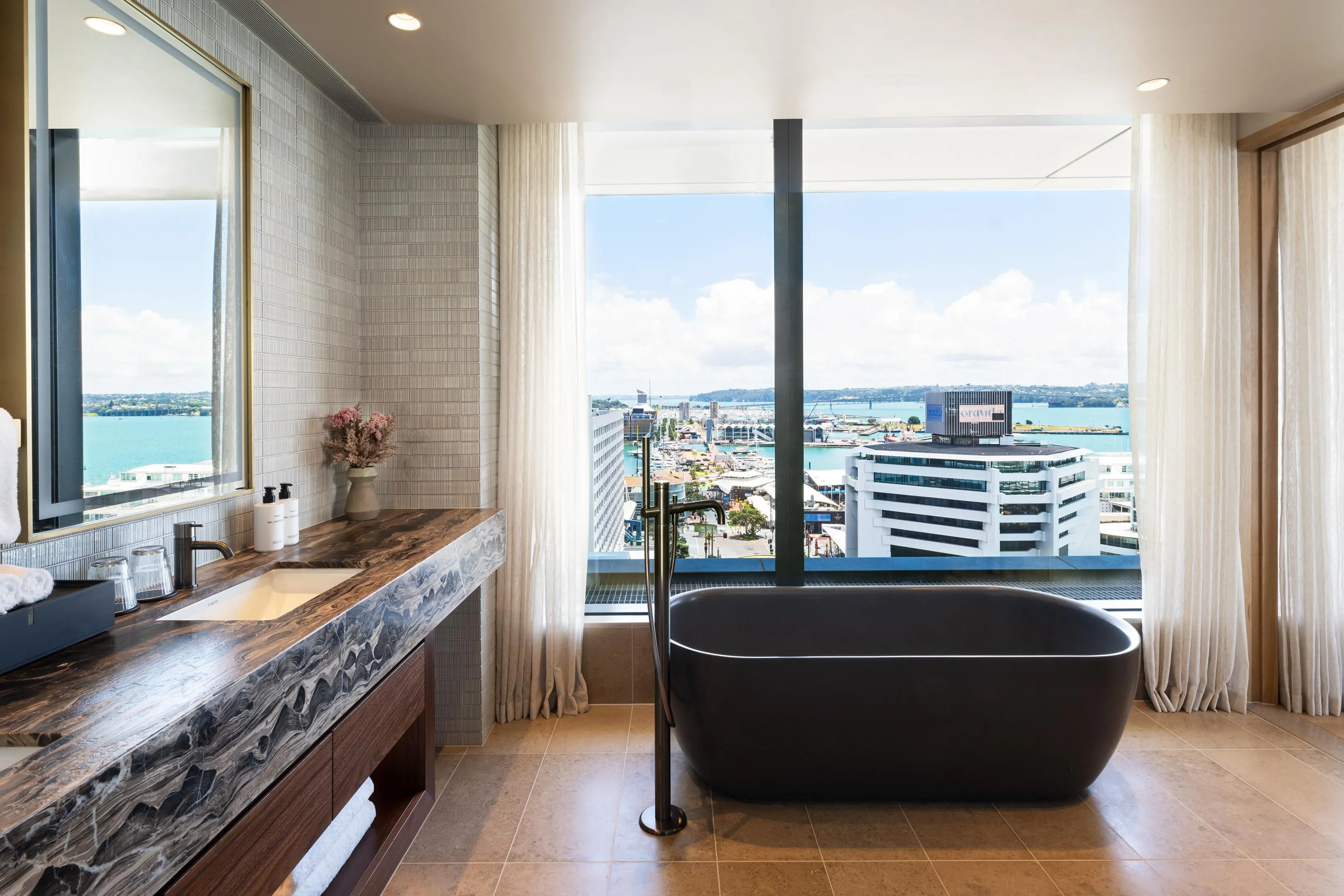 InterContinental Auckland guest room with veneer wall panelling and Italian marble vanity
