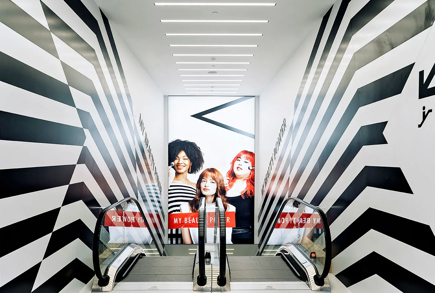 Sephora store with black-and-white striped escalator atrium, Auckland